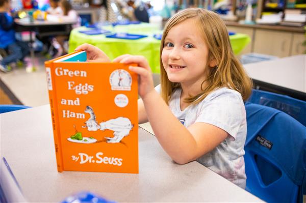 Students learning about Green Eggs and Ham and how to make them. 